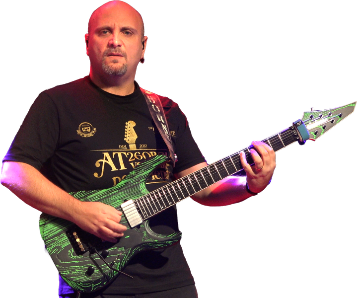 Marco Sfogli playing a green seven-string guitar
